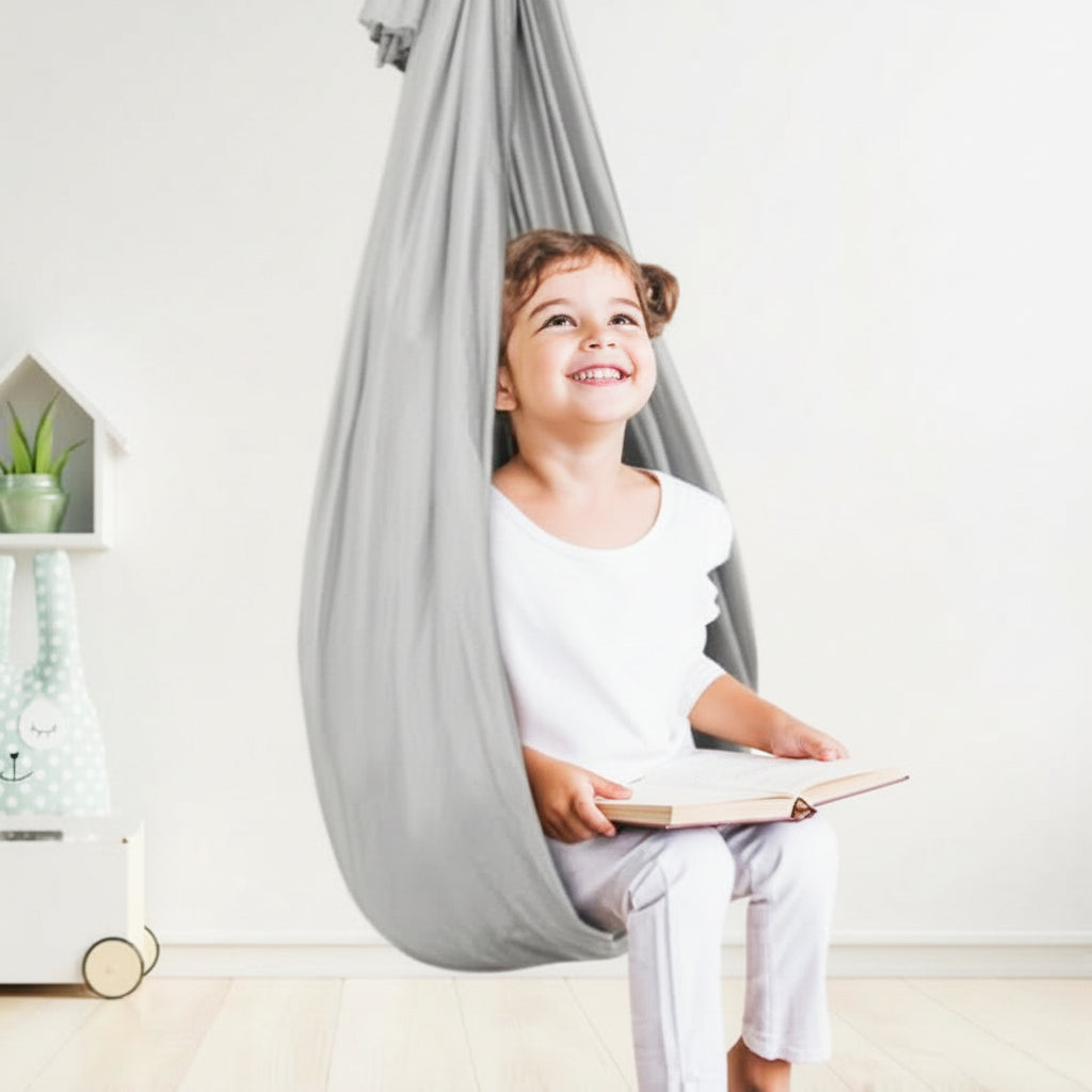 Durable indoor sensory swing for children, aiding sensory processing & providing a calming focus tool.