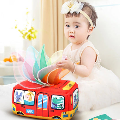 Educational baby toy: colorful fabric tissue box with soft, removable tissues for sensory exploration.