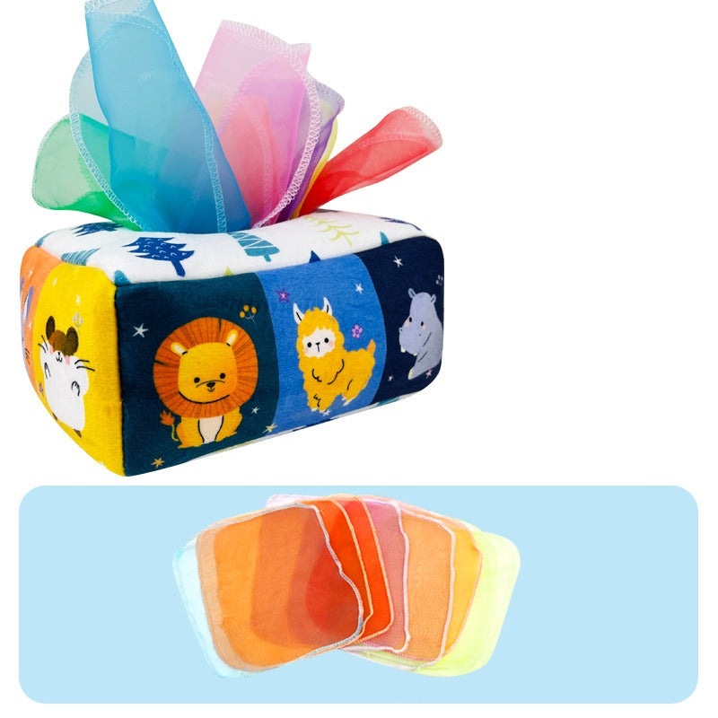Soft fabric tissue box toy with brightly colored scarves, perfect for baby's sensory stimulation.