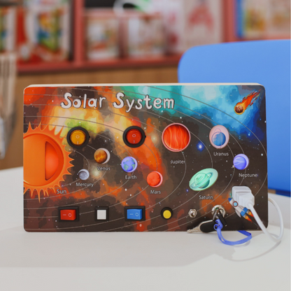 Children's space exploration busy board with rocket, planets, and gears for sensory and motor skill development