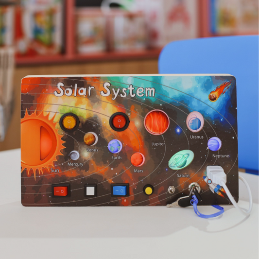 Children's space exploration busy board with rocket, planets, and gears for sensory and motor skill development