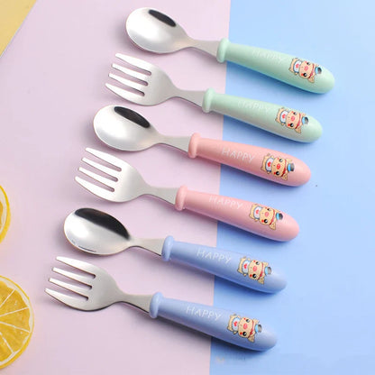 Toddler stainless steel fork and spoon kit with easy-grip handles, perfect for self-feeding