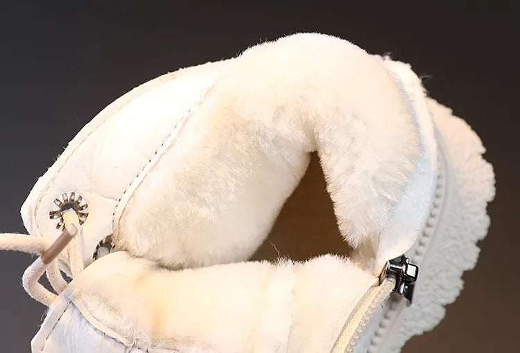 Detail of non-slip sole on a child's waterproof winter ankle boot with zipper