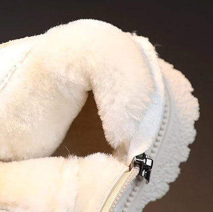 Close-up of children's trendy ankle rain boots, showing waterproof rubber texture and zipper