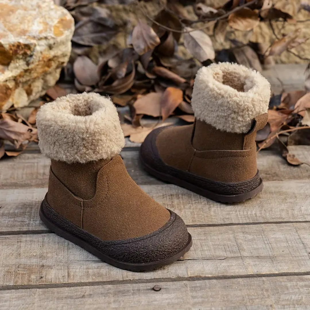 Pair of durable children's winter boots, fleece-lined, brown leather, with practical zipper and non-slip sole