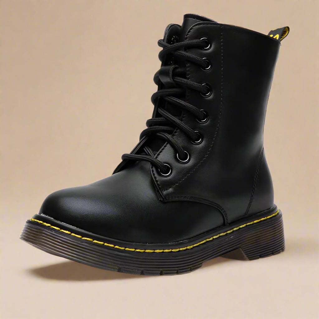 Kids black waterproof winter combat boots offering insulation, non-slip grip, and easy-on side zipper