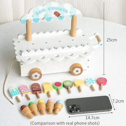 Wooden ice cream truck play set featuring a serving window and colorful toy treats