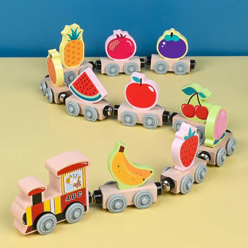 Overhead view of a wooden magnetic train layout, showing various tracks and a complete train set for creative play