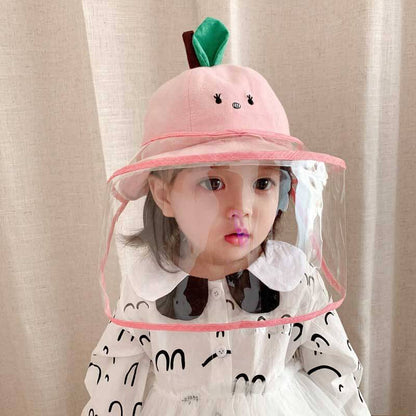 Toddler wearing a yellow children's protective fisherman hat outdoors, side view
