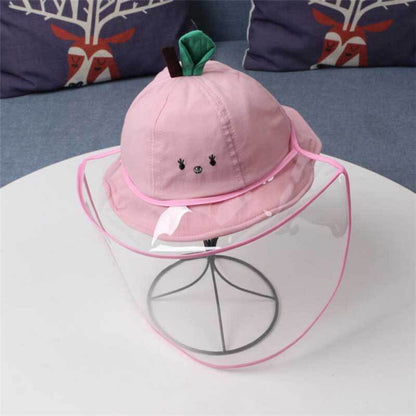 Cute baby in a blue cotton fisherman hat, protecting from sun, close up