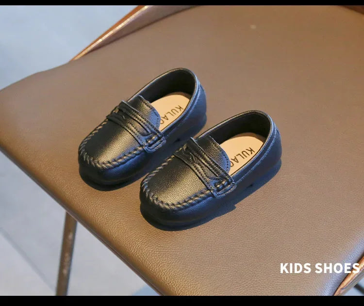 Boys' black leather slip-on loafers, essential school shoes for a smart and practical choice.