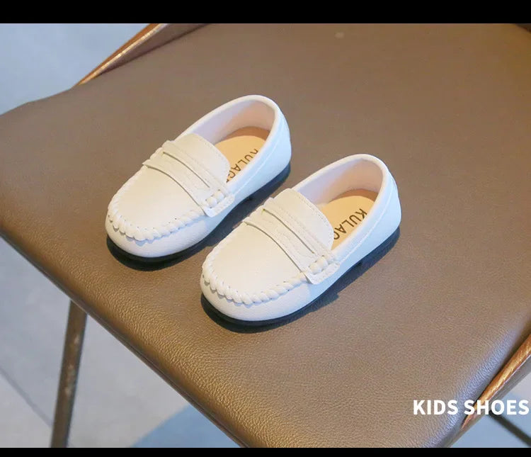 Elegant black leather slip-on loafers for boys, perfect for school and formal gatherings.