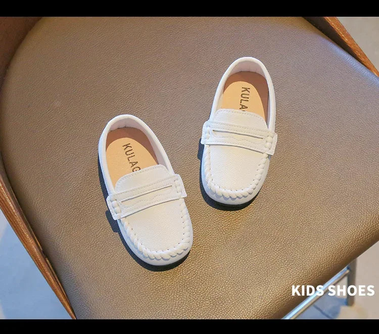 Boys' black leather slip-on formal shoes, an essential item for their school and dressy wardrobe.