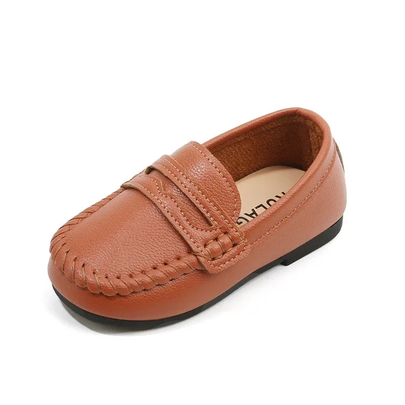 Comfortable boys' black leather slip-on loafers, designed for school, with a durable sole.