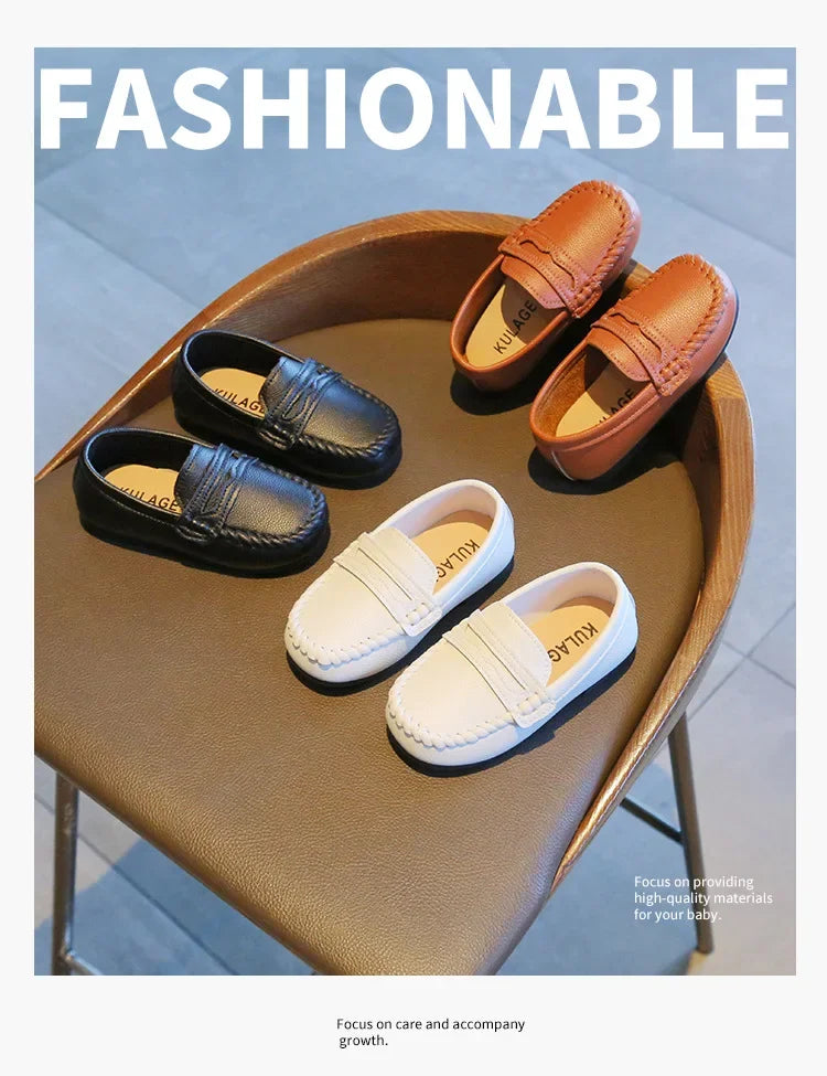 Boys' classic black leather slip-on loafers with a polished finish, great for school attire.