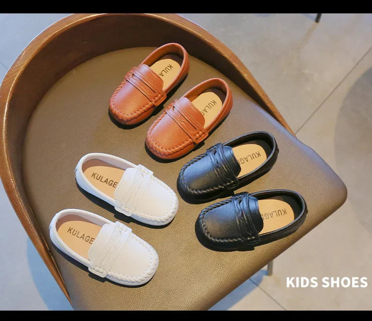 Durable black leather slip-on school shoes for boys, offering both style and comfort.