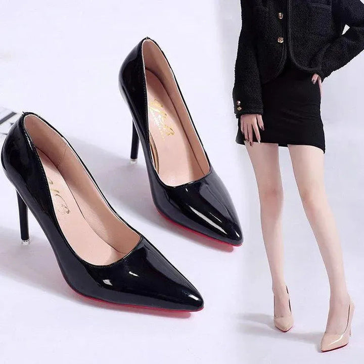 Classic black stiletto pumps for women. Pointed toe, high heel. Elegant office or party wear.