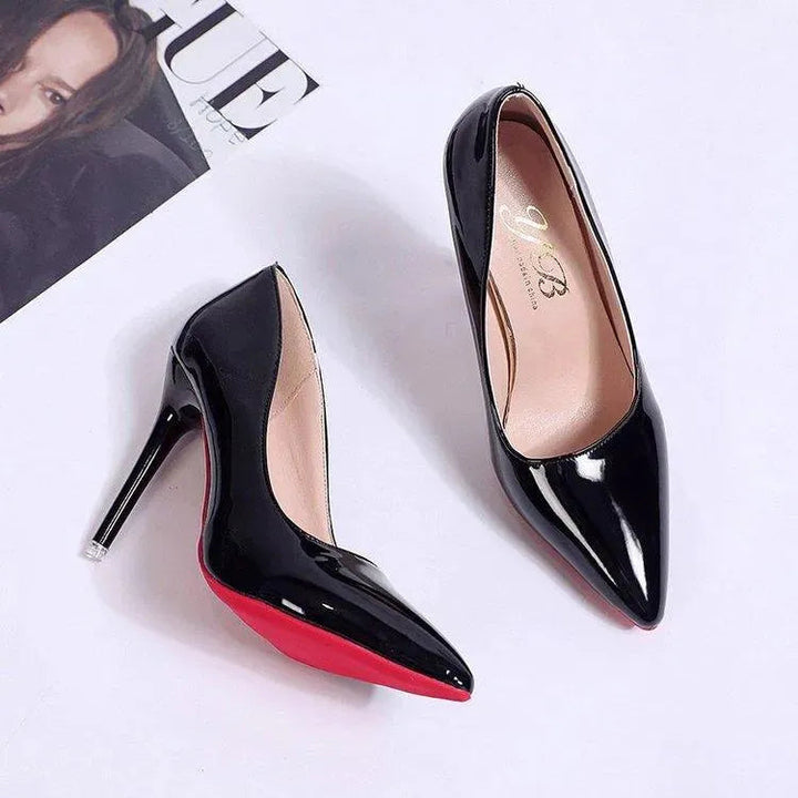 Chic pink stiletto high heels on foot. Pointed toe party pumps for women.