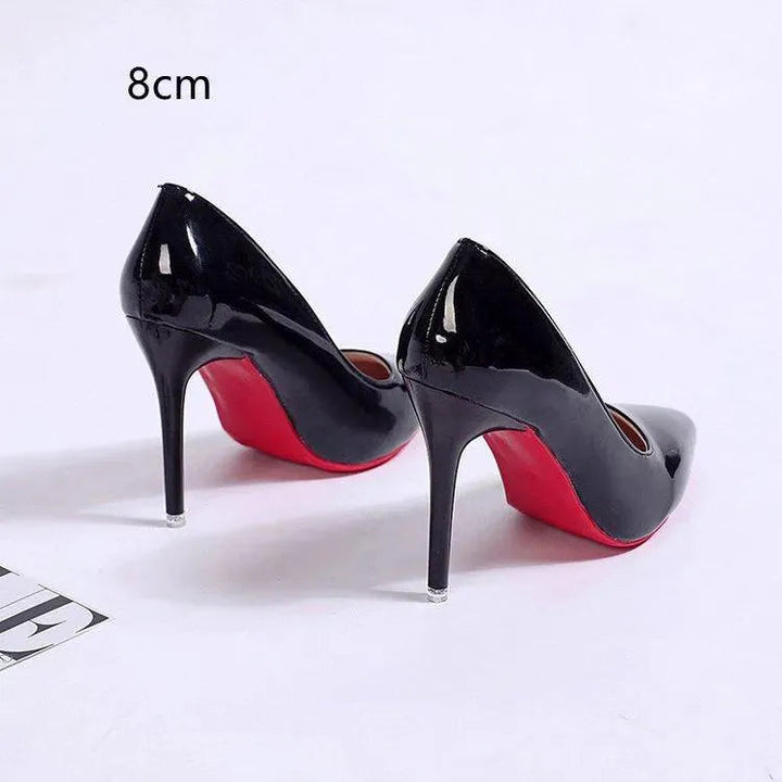 Elegant black pointed toe stiletto pumps for formal events. Classic women's high heels.