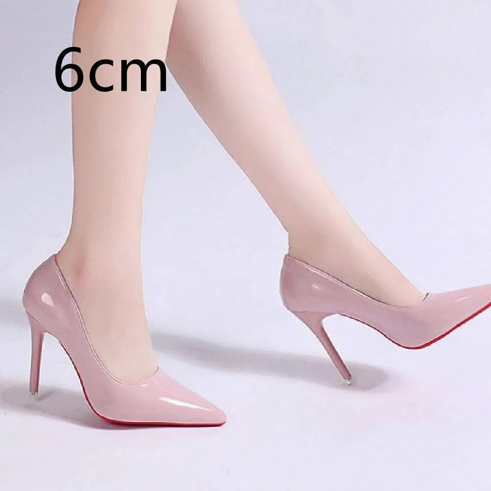 Classic elegant pink stiletto pumps, pointed toe high heels. Versatile women's formal footwear.