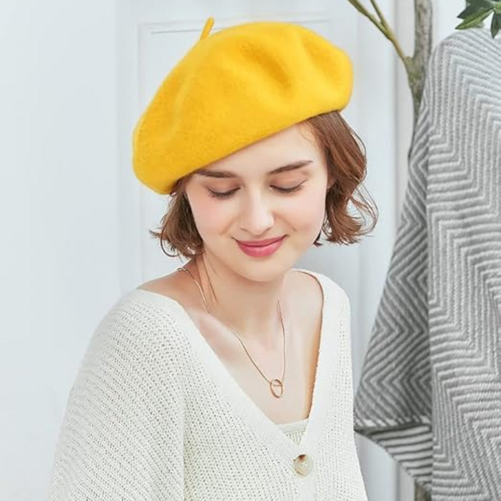 Elegant women's beret in deep green, a classic French style fashion accessory.