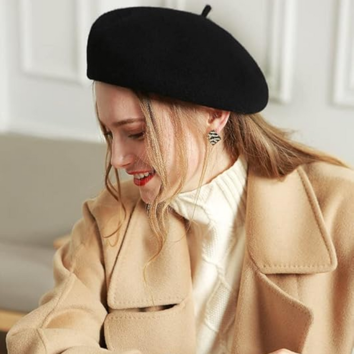 Stylish ladies beret in vibrant blue, a classic French accessory for winter fashion.