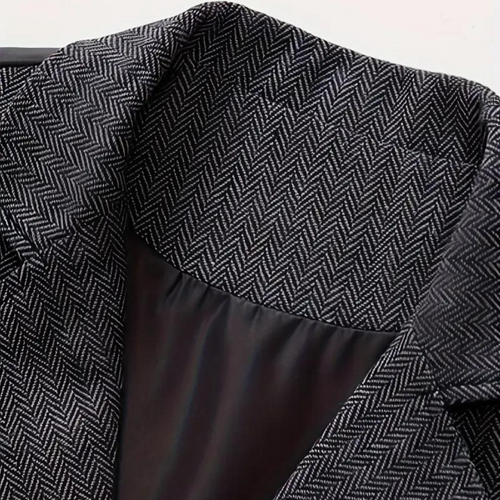 Detailed men's herringbone waistcoat, a sophisticated suit accessory for a vintage layered style.