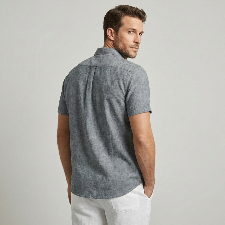 Tony men's short-sleeve collared shirt. A minimalist button-down for summer fashion.