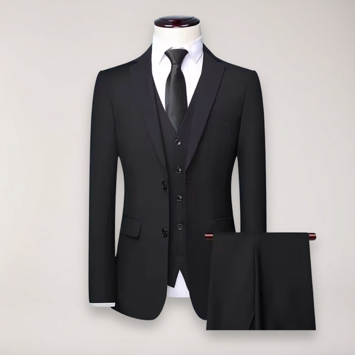 Men's formal wedding suit featuring a sophisticated three-piece design with blazer, vest & pants.