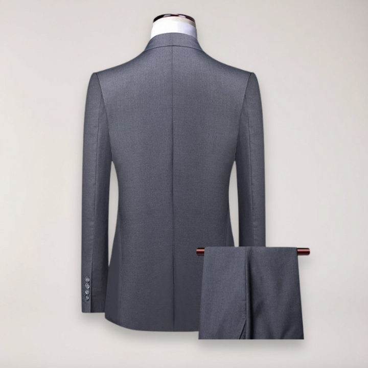 Menswear: Stylish three-piece suit with a classic blazer, waistcoat, and matching formal trousers.