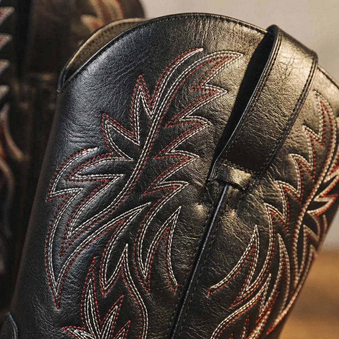 Rugged men's calf-length western boots. Classic slip-on cowboy style with detailed embroidery & sturdy block heel.