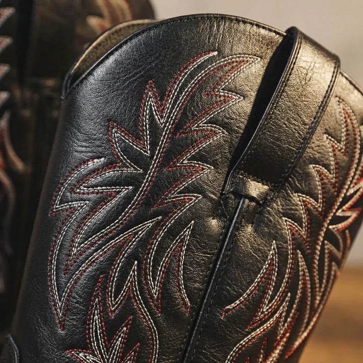 Rugged men's calf-length western boots. Classic slip-on cowboy style with detailed embroidery & sturdy block heel.