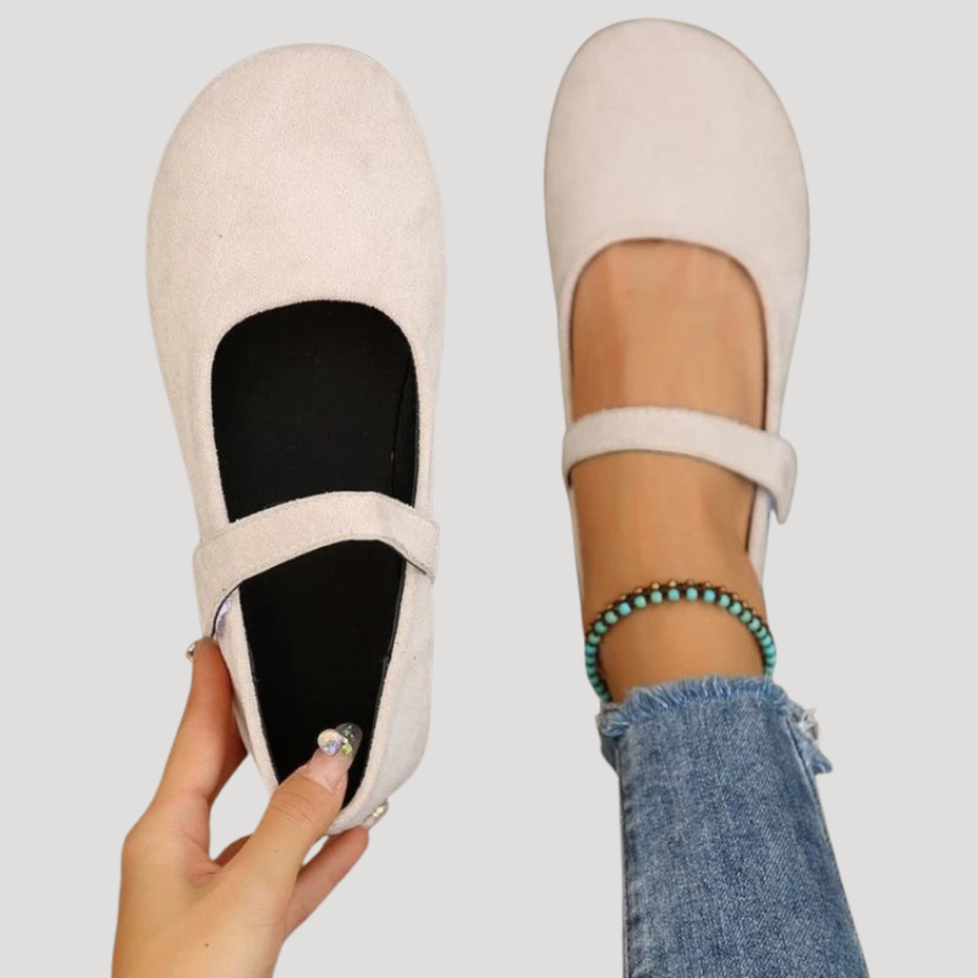 Classic women's Mary Jane flats with elegant buckle strap. Comfortable & versatile for everyday wear.