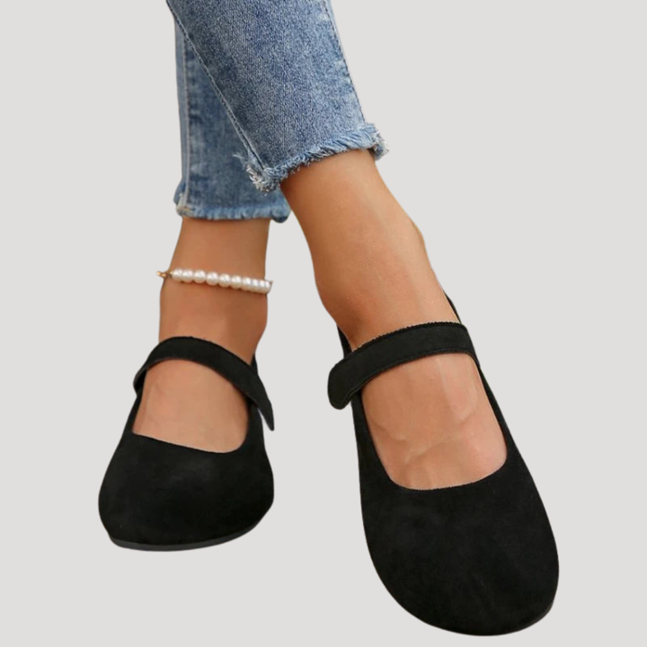 Black women's Mary Jane flats with buckle strap. Comfortable casual shoes perfect for everyday wear.