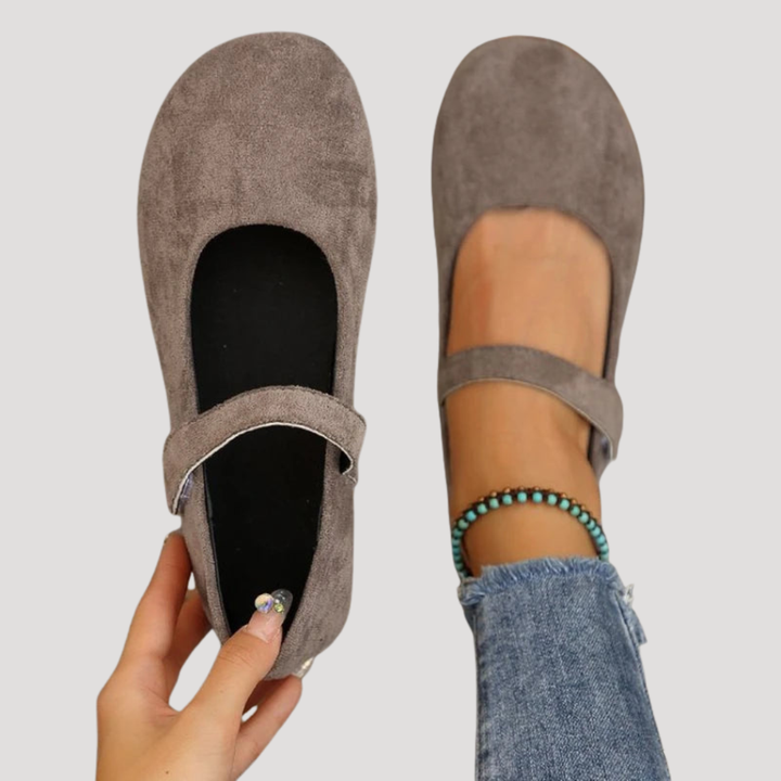 White classic Mary Jane flats for women. Stylish buckle strap and versatile for any casual outfit.