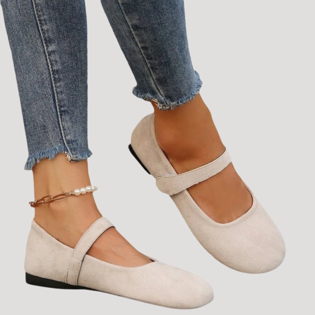 Brown women's Mary Jane flats. Comfortable buckle strap shoes for everyday wear and classic style.