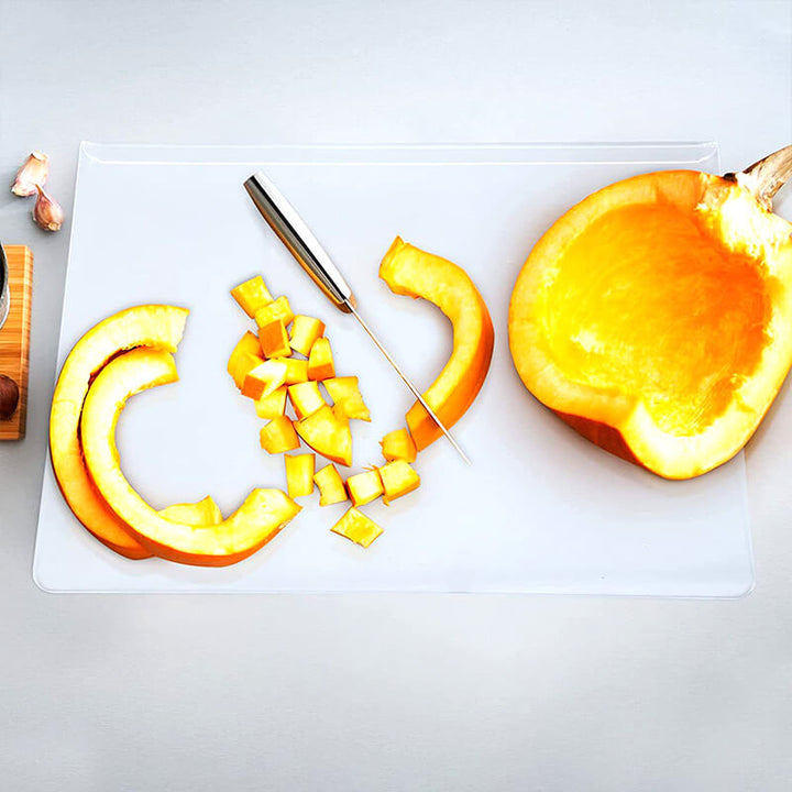 Safe non-slip acrylic cutting board, clear design, perfect for secure vegetable chopping & meat slicing.