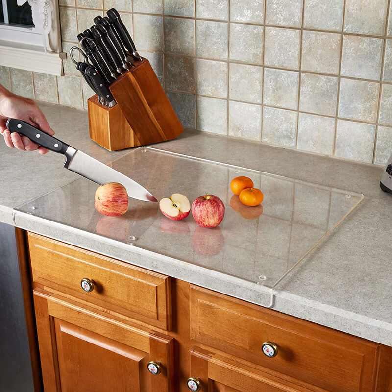 Elegant GlassEdge clear acrylic cutting board, non-slip for safe and modern kitchen food preparation.