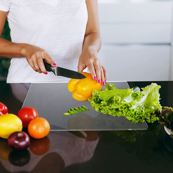 Durable clear acrylic cutting board with non-slip base, ensuring hygienic and stable food prep in any kitchen.