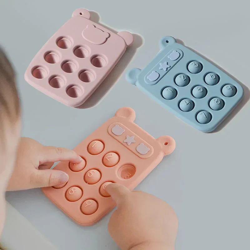 Close-up of a blue baby silicone fidget phone teether, ideal for infant sensory play and development.