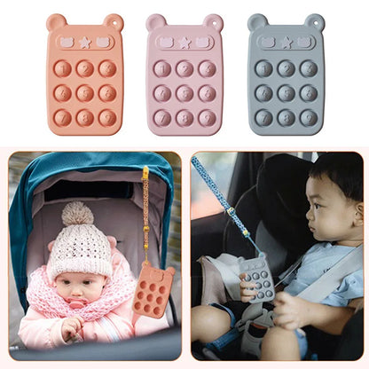 Gender-neutral green silicone fidget phone teether, a safe and engaging educational toy for toddlers.