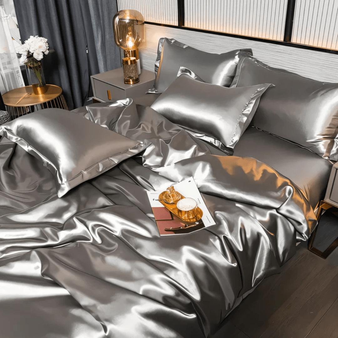 Full view of a complete polyester bedding set, including duvet, sheets, & pillowcases for a luxury bedroom.