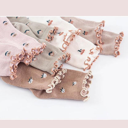 Close-up of a pair of children's floral pattern ankle socks, made from soft cotton, suitable for toddlers.