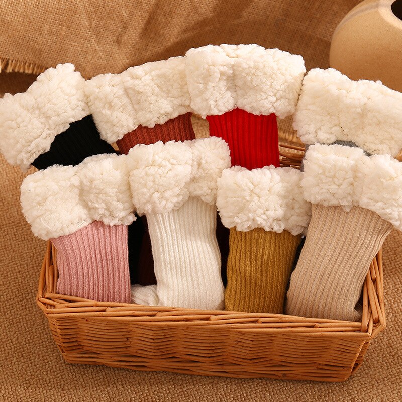 Close-up of the plush interior of a warm baby sock, emphasizing its cozy texture