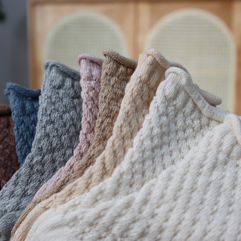 Package of multiple pairs of children's cotton mesh breathable ankle socks, ready for sale.