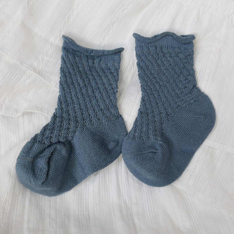 A pair of blue kids soft cotton mesh breathable ankle socks, perfect for baby clothing.