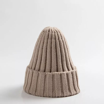 Folded unisex baby crochet winter beanie hat in a deep navy, showcasing the knit.