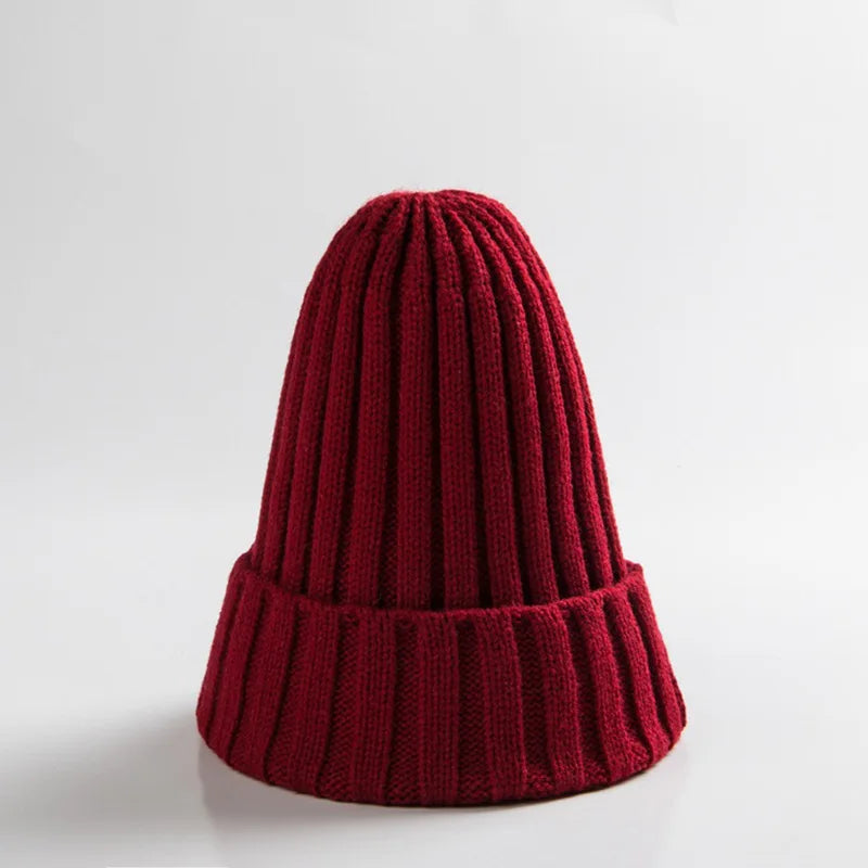Infant headwear: a cute, yellow unisex baby crochet winter beanie hat on a plain background.