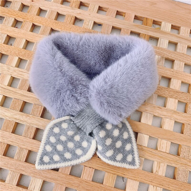 Infant modeling a cream faux fur scarf, fashionable and soft for baby warmth