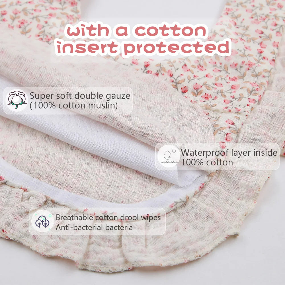 Organic cotton bandana bib with vibrant floral pattern, perfect for infant feeding & drooling